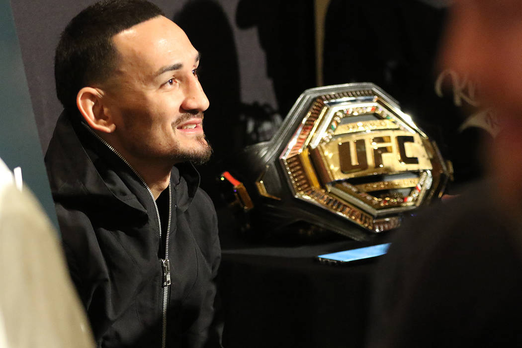 UFC featherweight champion Max Holloway takes questions during a UFC 245 media event at the Red ...