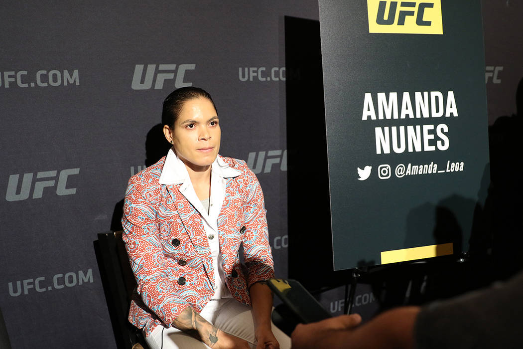UFC women's featherweight and bantamweight champion Amanda Nunes takes questions from reporters ...