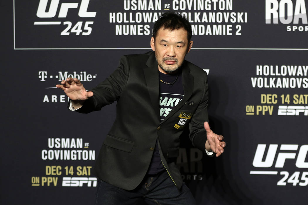 UFC Hall of Famer Kazushi Sakuraba poses after receiving his jacket during a UFC 245 media even ...