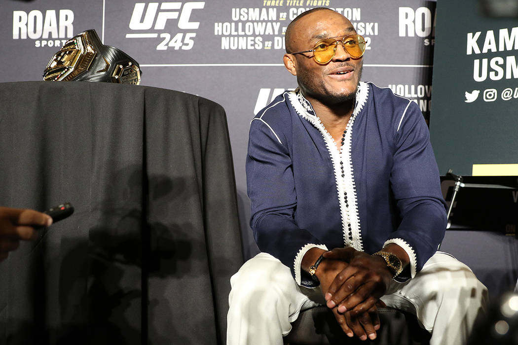 UFC middleweight champion Kamaru Usman speaks to reporters during a UFC 245 media event at the ...