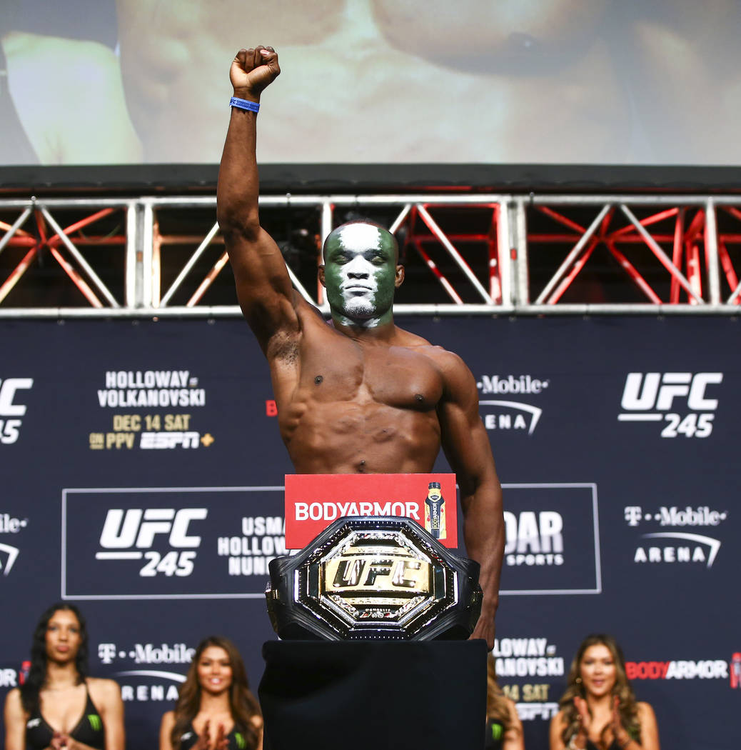 Kamaru Usman poses during the ceremonial weigh-in event ahead of his fight against Colby Coving ...