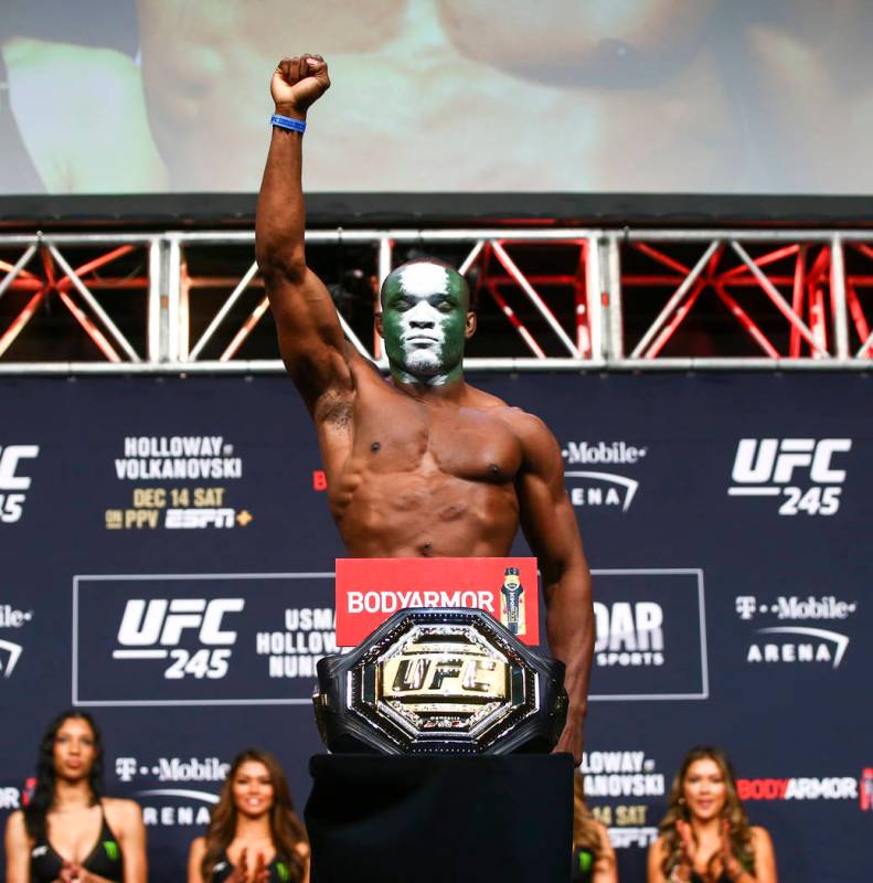 Kamaru Usman poses during the ceremonial weigh-in event ahead of his fight against Colby Coving ...