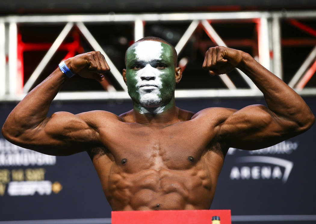 Kamaru Usman poses during the ceremonial weigh-in event ahead of his fight against Colby Coving ...