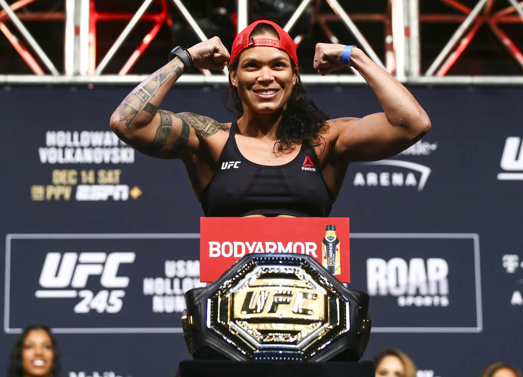 Amanda Nunes poses during the ceremonial weigh-in event ahead of her fight against Germaine de ...