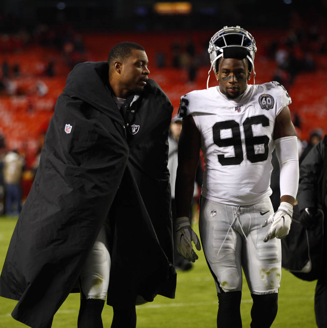 Oakland Raiders defensive end Dion Jordan (95) and defensive end Clelin Ferrell (96) walk off t ...