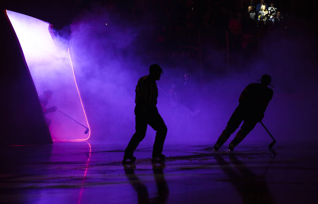 Golden Knights players and referees take the ice before the start of an NHL hockey game against ...