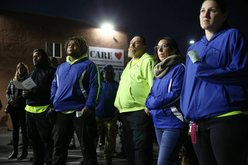 People attend a candlelight vigil to memorialize the homeless people of Las Vegas who died in t ...