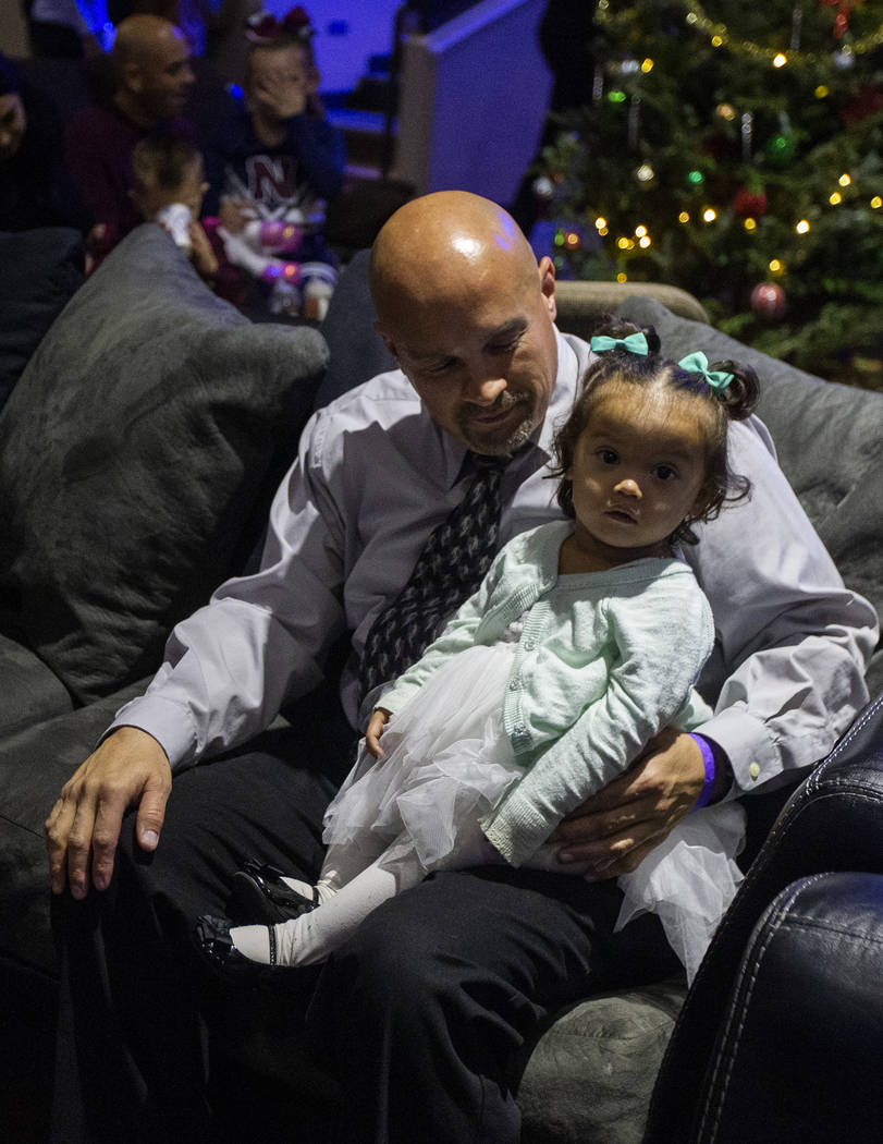 Chris Ritenour holds his daughter, Rayleigh Ritenour, 1, for the second time in her life at HOP ...