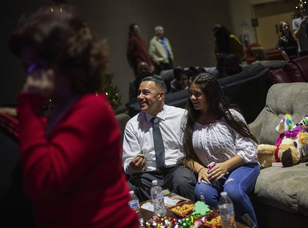 Jimmy Bocanegra, center, laughs with his daughter, Arianna Bocanegra, 11, right, as his mother ...