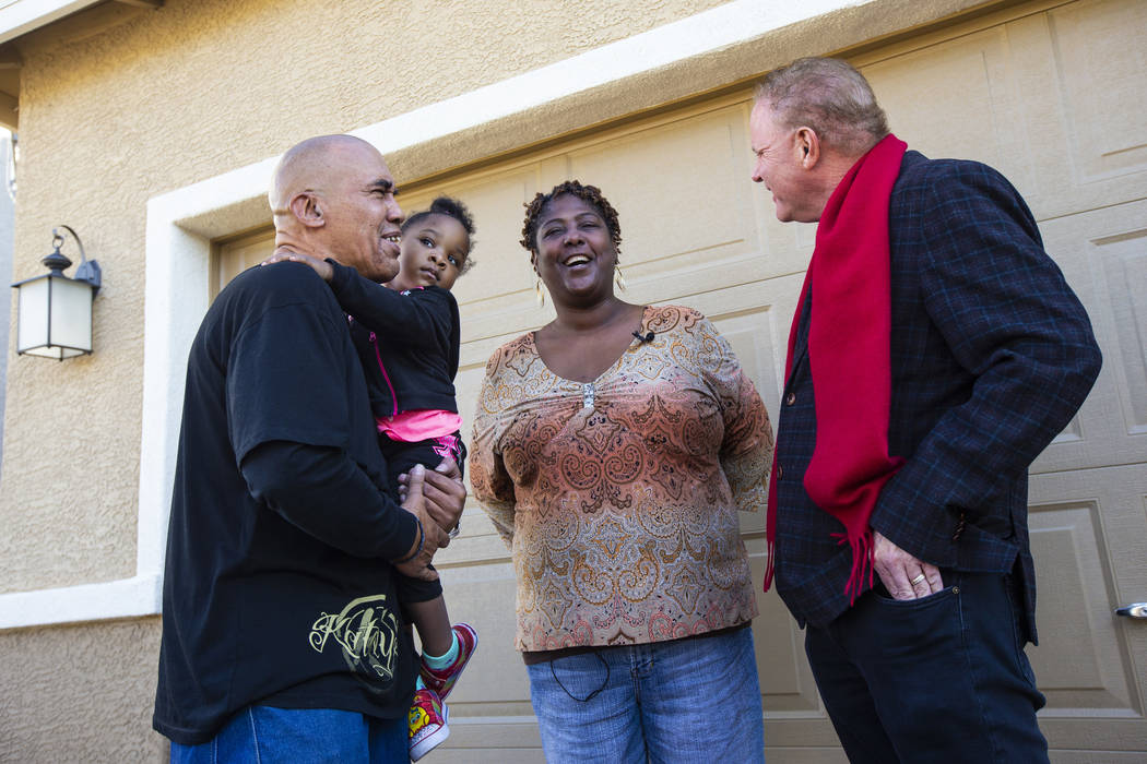 Lucille McKnight, center, with her partner, Kyle Turpin, left, holding her great-niece, Christi ...