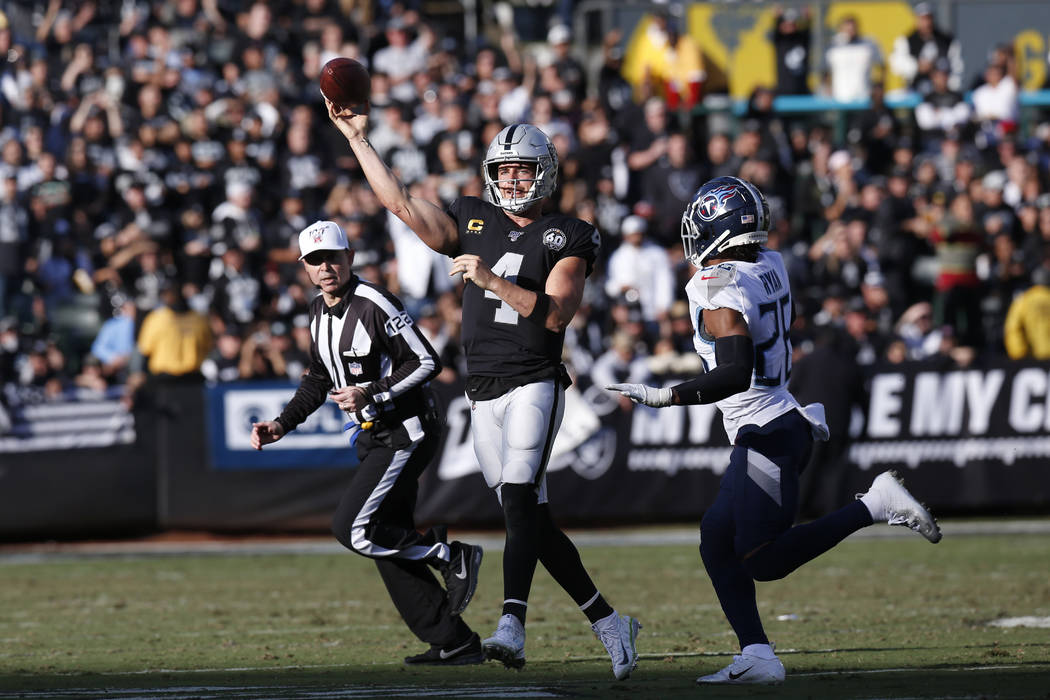 Oakland Raiders quarterback Derek Carr (4) passes against Tennessee Titans cornerback Logan Rya ...