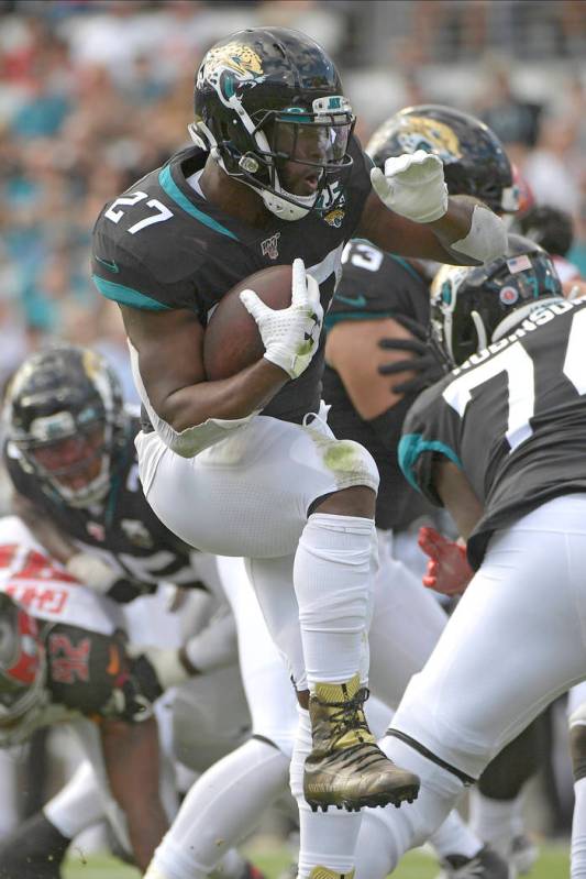 Jacksonville Jaguars running back Leonard Fournette (27) runs against the Tampa Bay Buccaneers ...