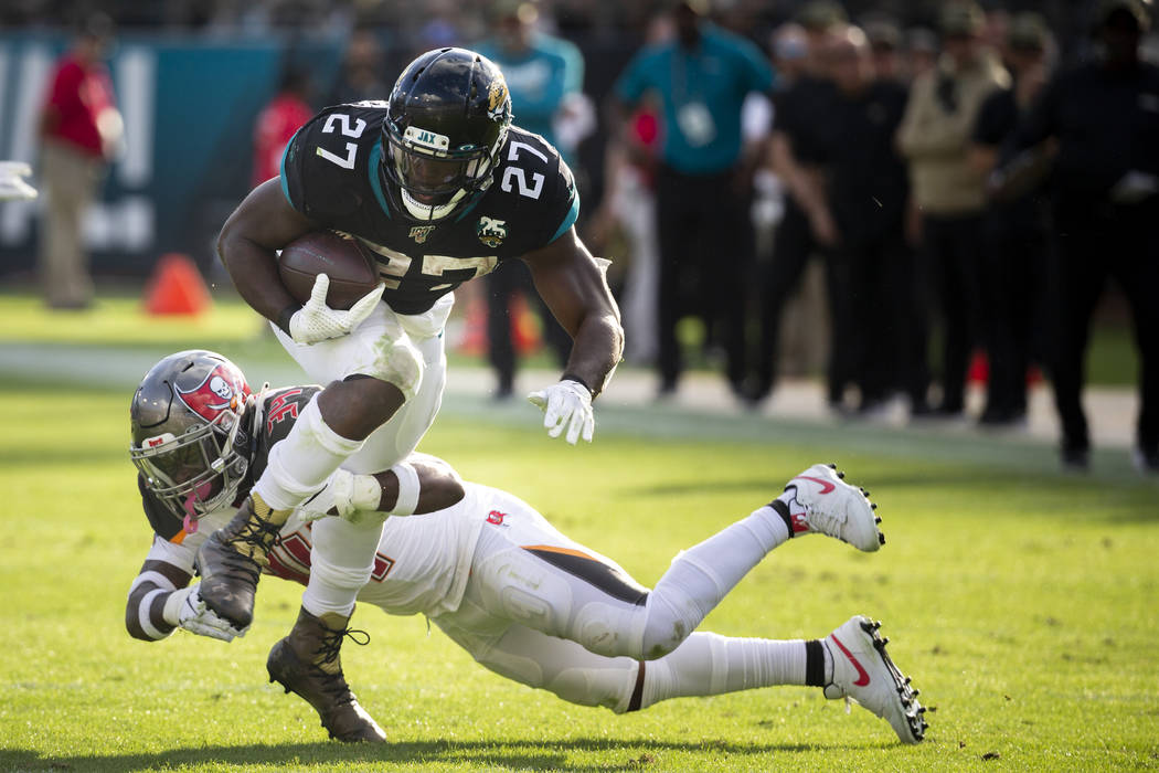 Jacksonville Jaguars running back Leonard Fournette (27) runs the ball against Tampa Bay Buccan ...