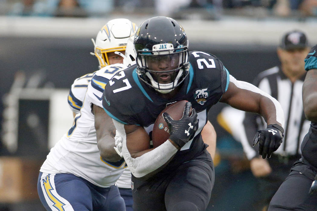 Jacksonville Jaguars running back Leonard Fournette (27) runs against the Los Angeles Chargers ...