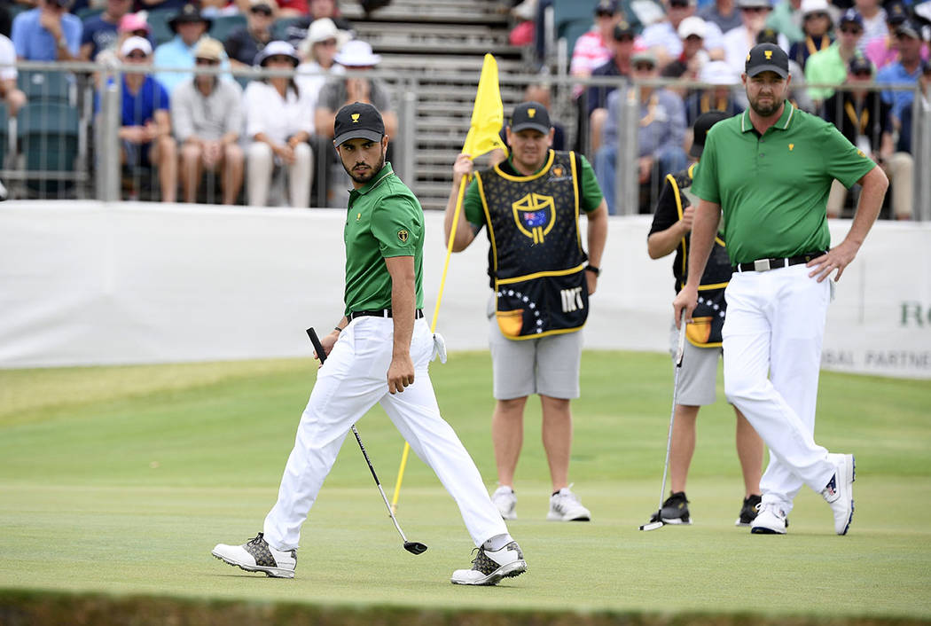 International team player Abraham Ancer of Mexico, left, and playing partner Marc Leishman of A ...