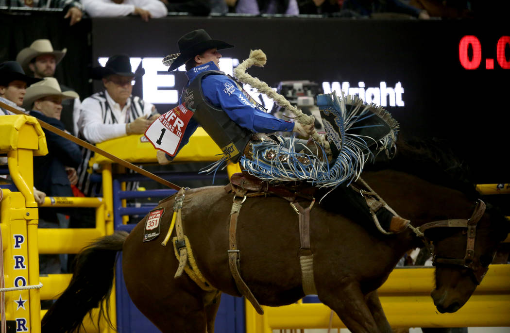 Ryder Wright of Milford, Utah rides Toma Jo in Saddle Bronc Riding during the ninth go-around o ...