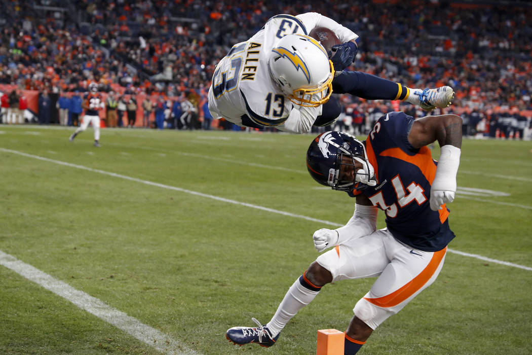 Los Angeles Chargers wide receiver Keenan Allen scores over Denver Broncos strong safety Will P ...