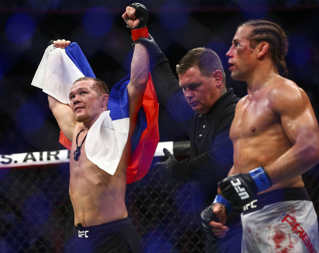 Petr Yan celebrates his knockout win against Urijah Faber in their bantamweight bout in UFC 245 ...