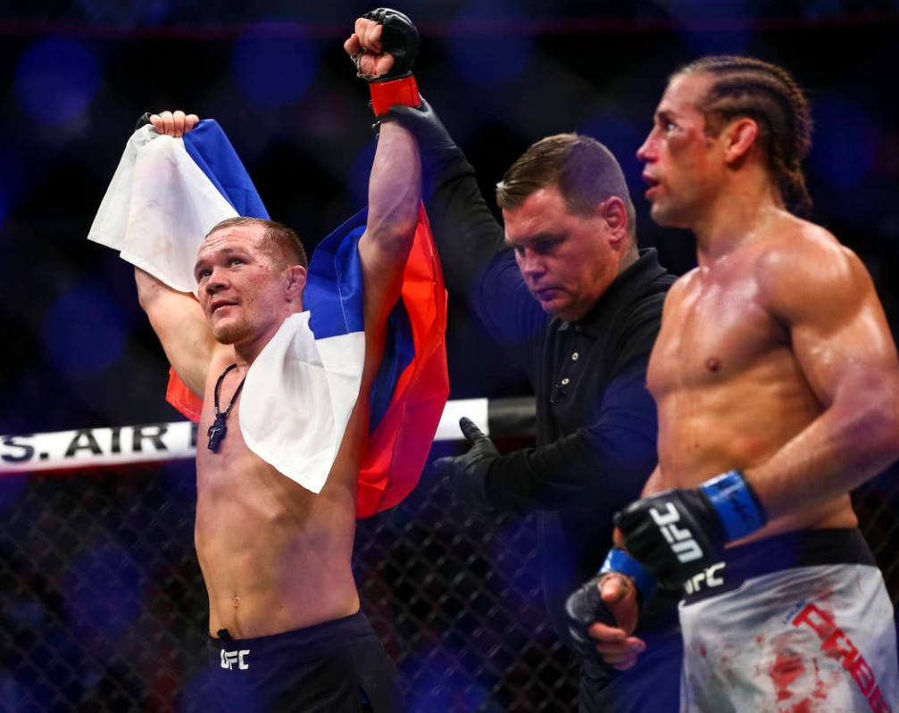 Petr Yan celebrates his knockout win against Urijah Faber in their bantamweight bout in UFC 245 ...