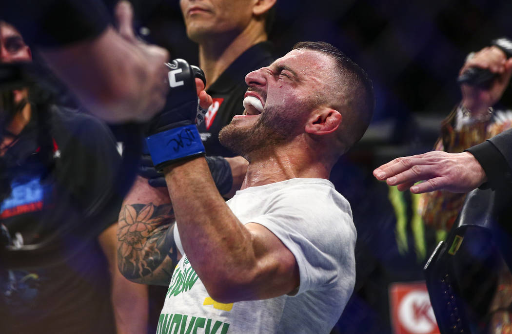 Alexander Volkanovski reacts after being declared the winner via unanimous decision over Max Ho ...