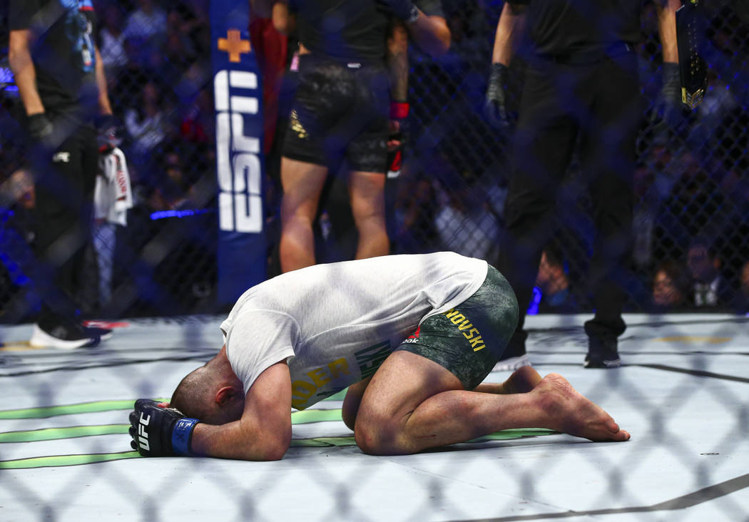 Alexander Volkanovski reacts after being declared the winner via unanimous decision over Max Ho ...