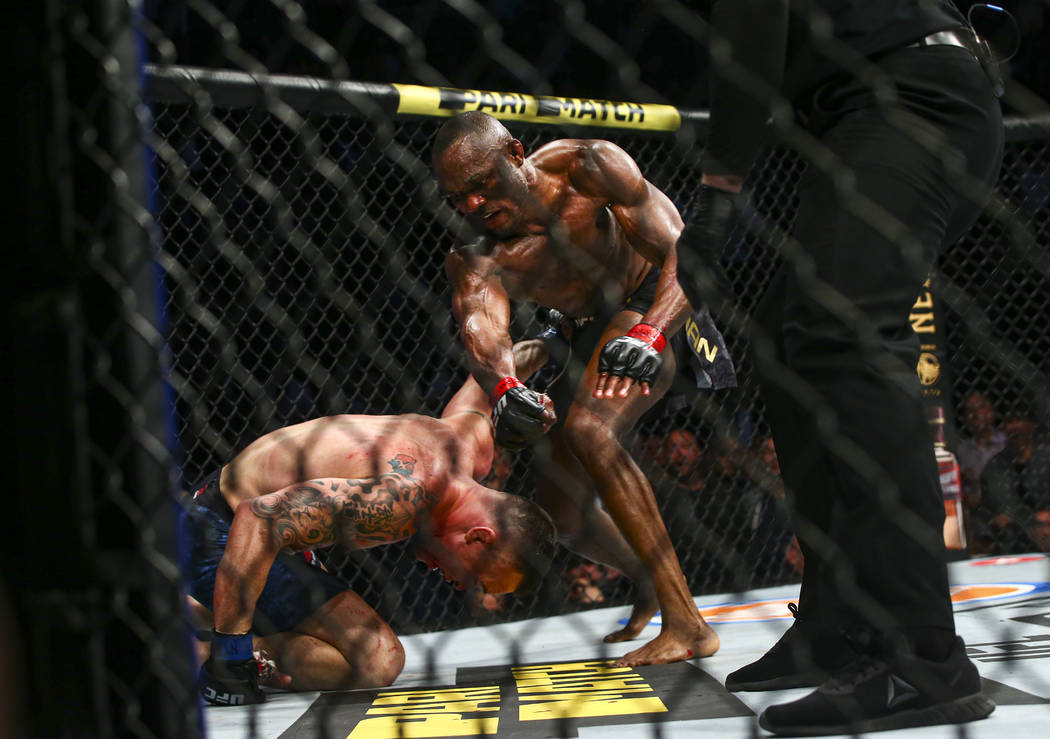 Kamaru Usman, right, fights Colby Covington during their welterweight title bout UFC 245 at T-M ...