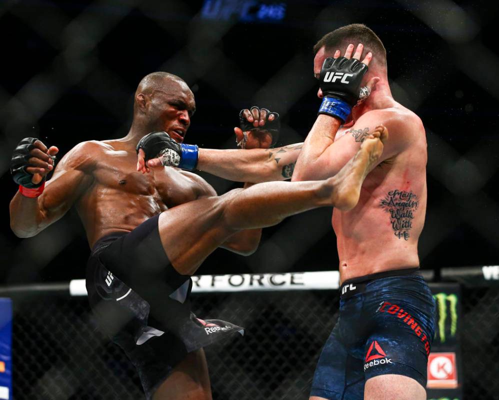 Kamaru Usman, left, fights Colby Covington during their welterweight title bout UFC 245 at T-Mo ...