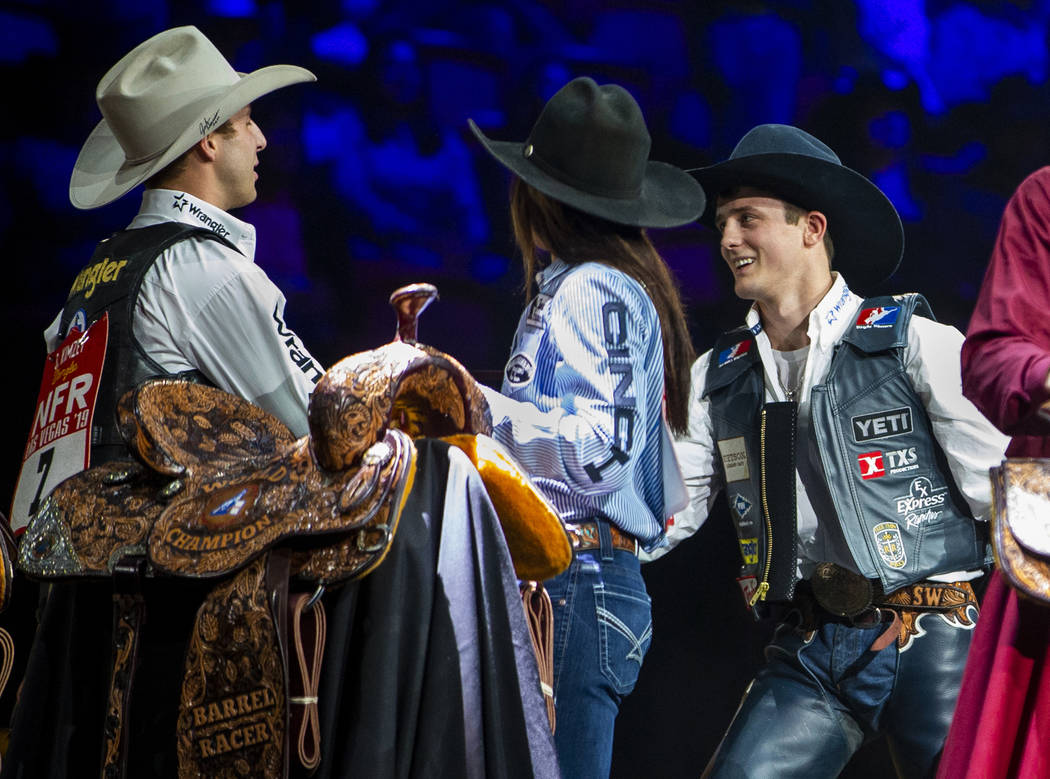 Stetson Wright of Milford, Utah, right, named the All-Around World Champion congratulates All-A ...