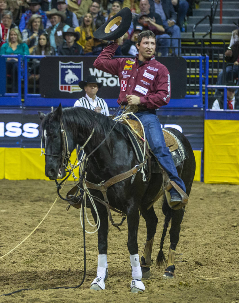 Haven Meged of Miles City, Mont., thanks the fans in Tie-Down Roping at the tenth go round of t ...