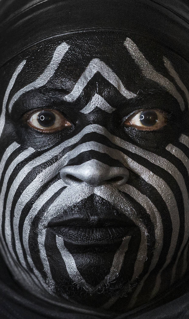 Raiders super fan Wayne Mabry, known as "Violator," in his hotel room at 4 a.m. in Du ...