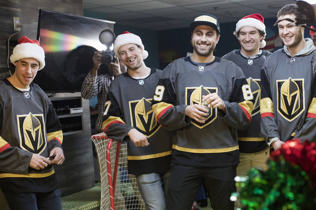 Golden Knights players, from left, Reilly Smith, Shea Theodore, Alex Tuch, Mark Stone, and Bray ...