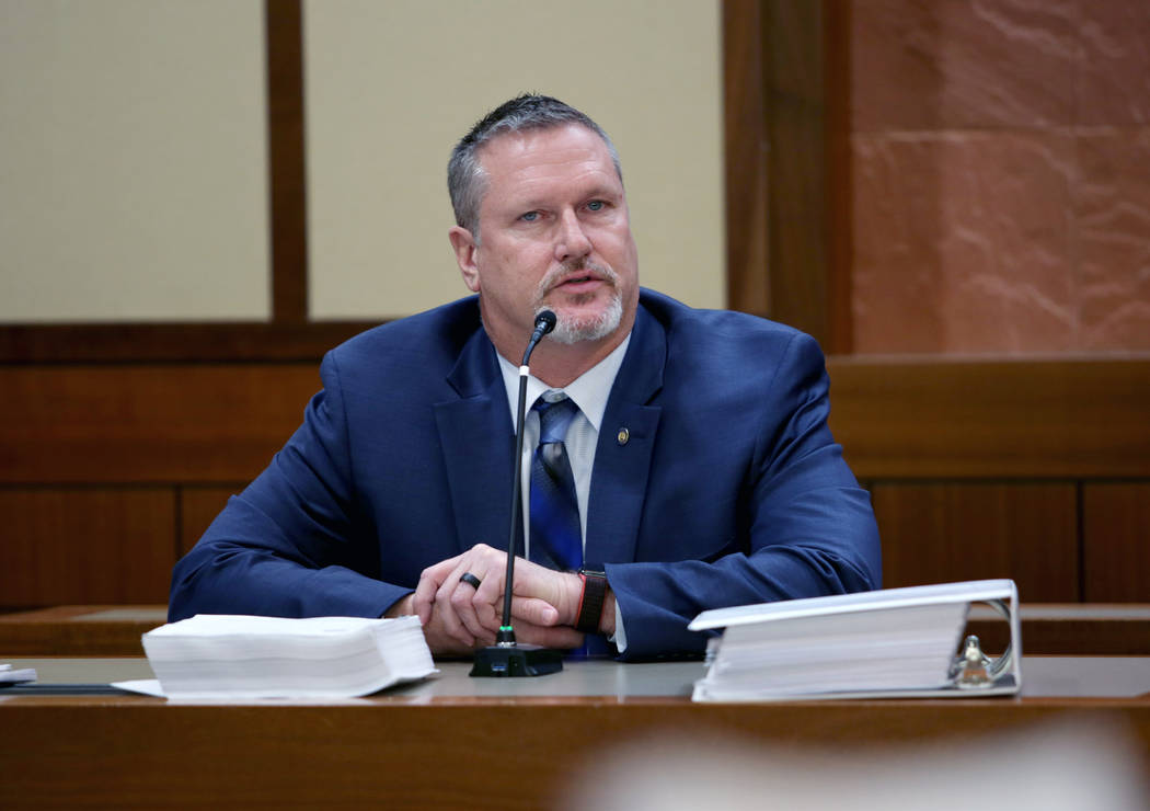 Former Las Vegas Justice Court administrator David Denson is questioned by Brian Hutchins, a pr ...