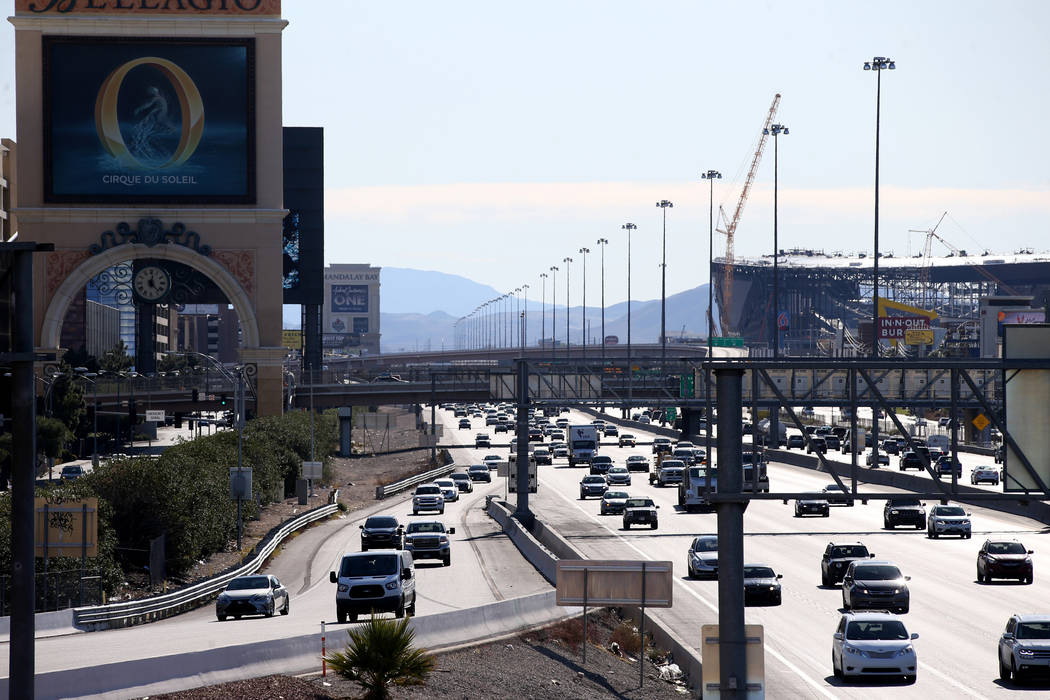 Vehicles travel on Interstate 15 adjacent to the Strip in Las Vegas Monday, Dec. 16, 2019. (K.M ...