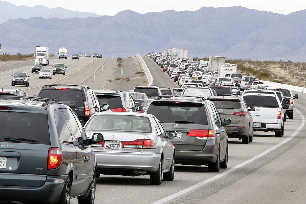 Traffic ibuilds on southbound Interstate 15 near Jean as holiday travelers leave Las Vegas, mos ...