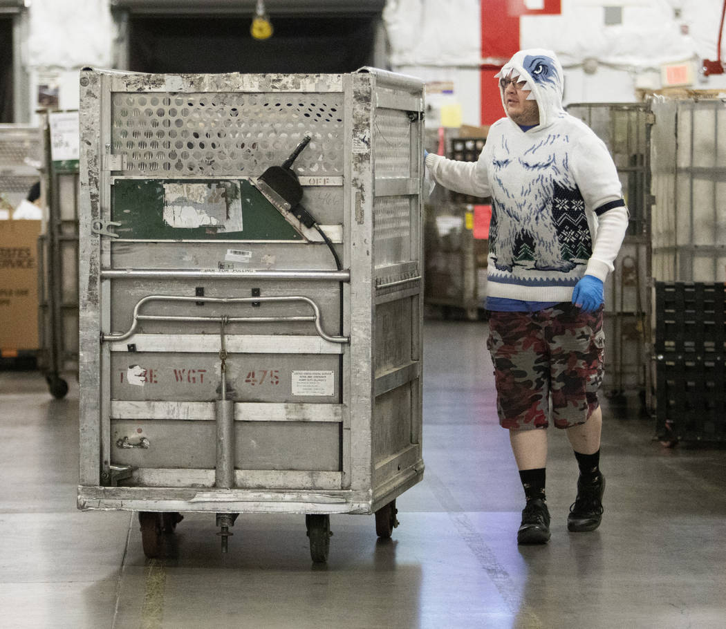 Joshua Robinson of Las Vegas wears a "Bumble" sweater, the abominable snowman from th ...