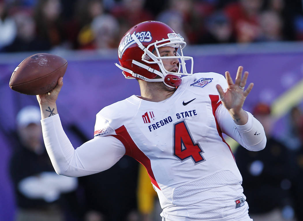 Fresno State quarterback Derek Carr (4) attempts a pass while taking on USC during the Royal Pu ...