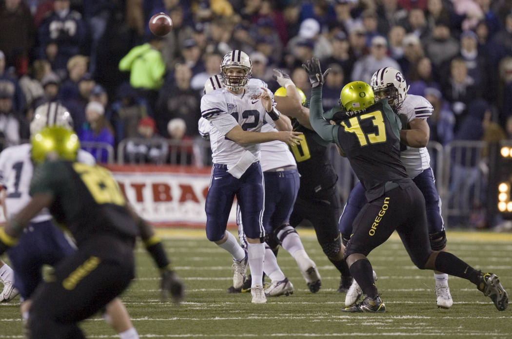 BYU quarterback John Beck throws a pass in the fourth quarter against Oregon in the Las Vegas B ...