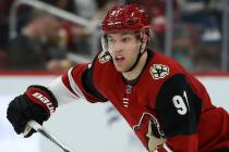 Arizona Coyotes left wing Taylor Hall skates to the puck against the Minnesota Wild during the ...