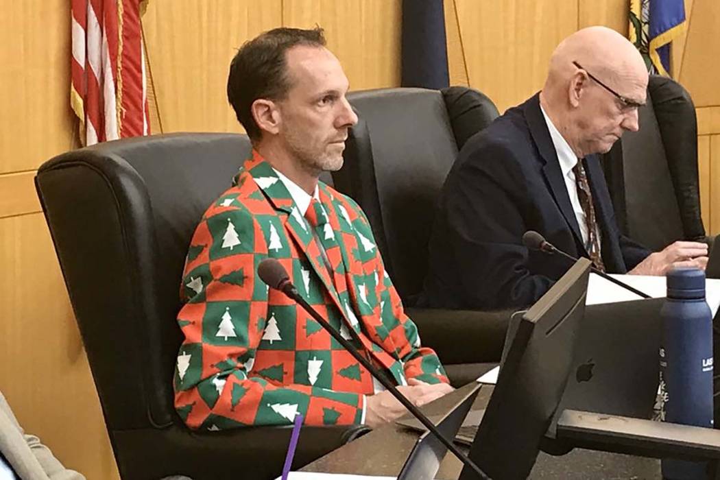 Clark County Commissioner Justin Jones, left, wore a Christmas suit to a Clark County zoning me ...