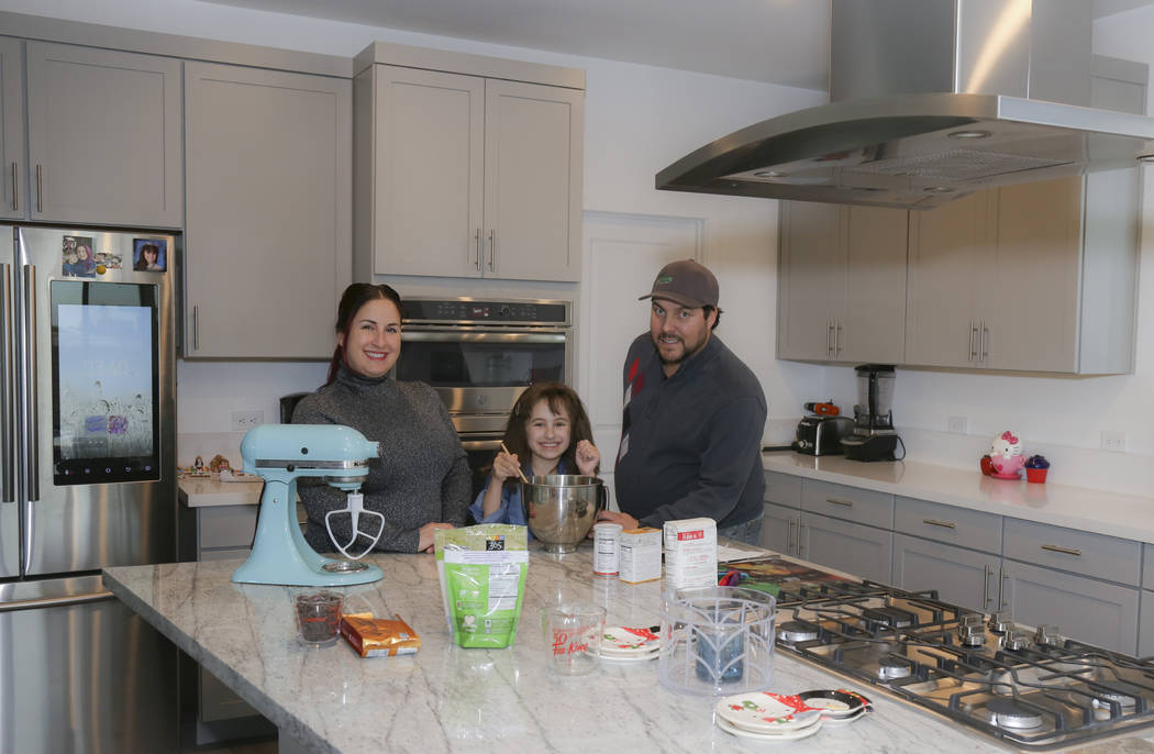 Bonnie D’Amico, her daughter, Mia, and fiancée, Joe Cantino, are in the kitchen of their new ...