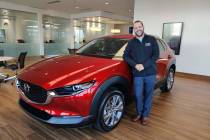 Kevin Lopes, the marketing manager for Findlay Mazda, shows off the 2020 Mazda CX-30 crossover ...