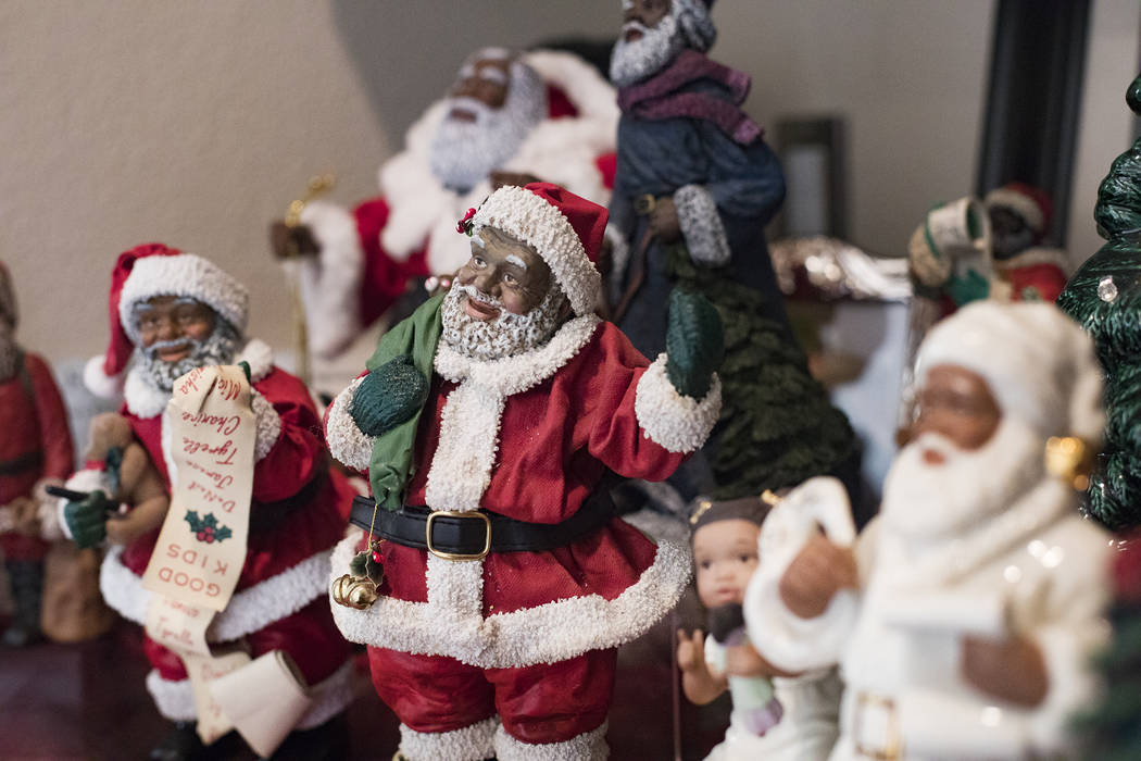 Santa Claus figurines at the home of Roxanne Givens in Las Vegas, Wednesday, Dec. 18, 2019. Giv ...