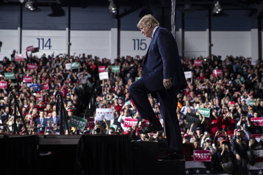 President Donald Trump arrives at W.K. Kellogg Airport to attend a campaign rally, Wednesday, D ...