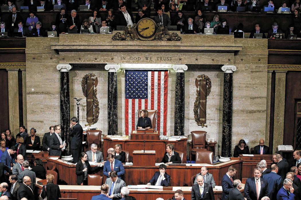 House Speaker Nancy Pelosi of Calif., speaks during a vote on the articles of impeachment again ...