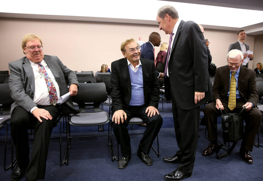 Phil Ruffin, center, visits with Nevada Gaming Commission member Steve Cohen before a NGC heari ...