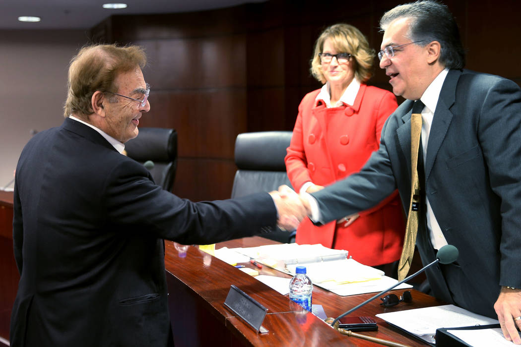 Phil Ruffin, left, greets Nevada Gaming Commission members Chairman Tony Alamo and Commissioner ...