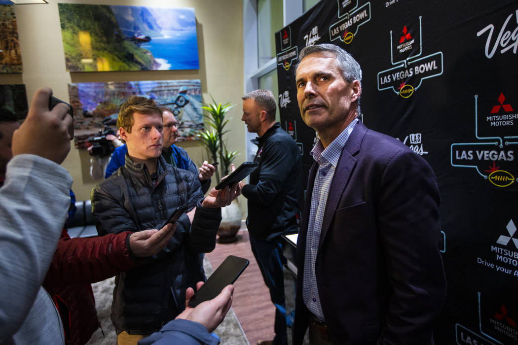 Washington head coach Chris Petersen speaks with reporters ahead of the Las Vegas Bowl NCAA col ...