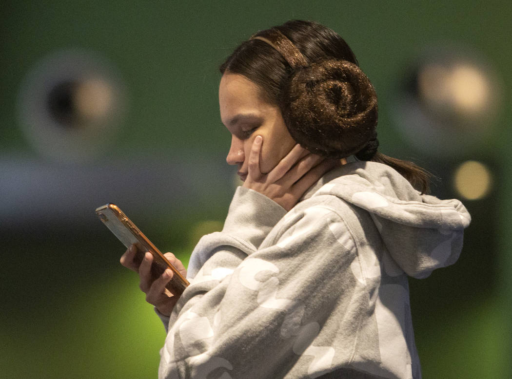 Sydney Pollard of Las Vegas wears a Princess Leia headband at the Star Wars: The Rise of Skywal ...