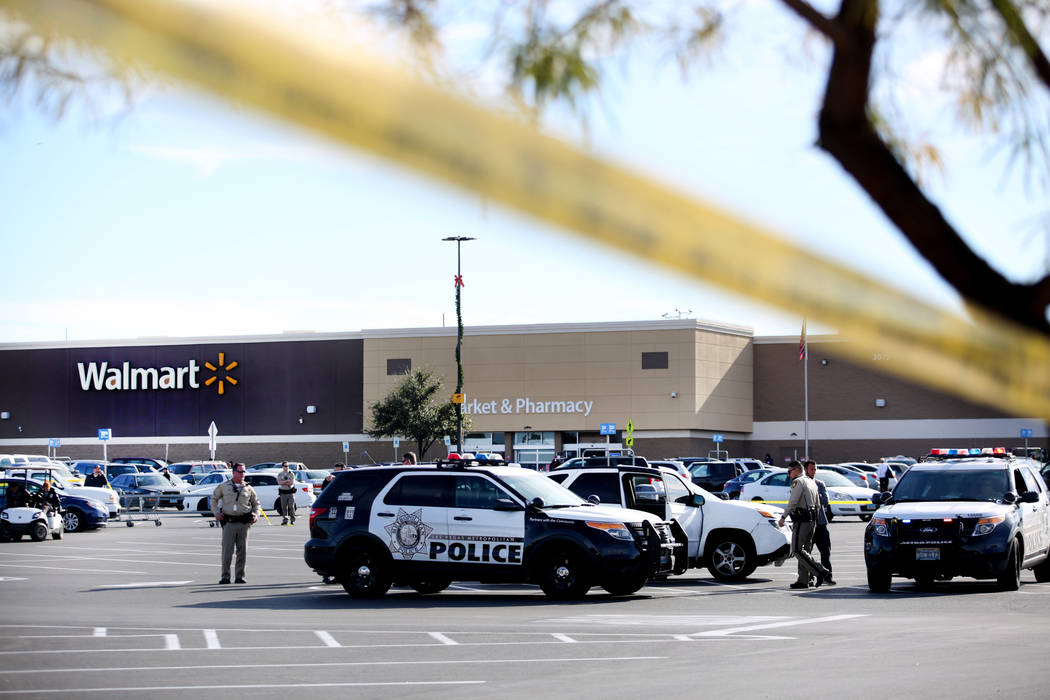 Police block off a parking lot near a Walmart Supercenter on the 3000 block of East Tropicana A ...