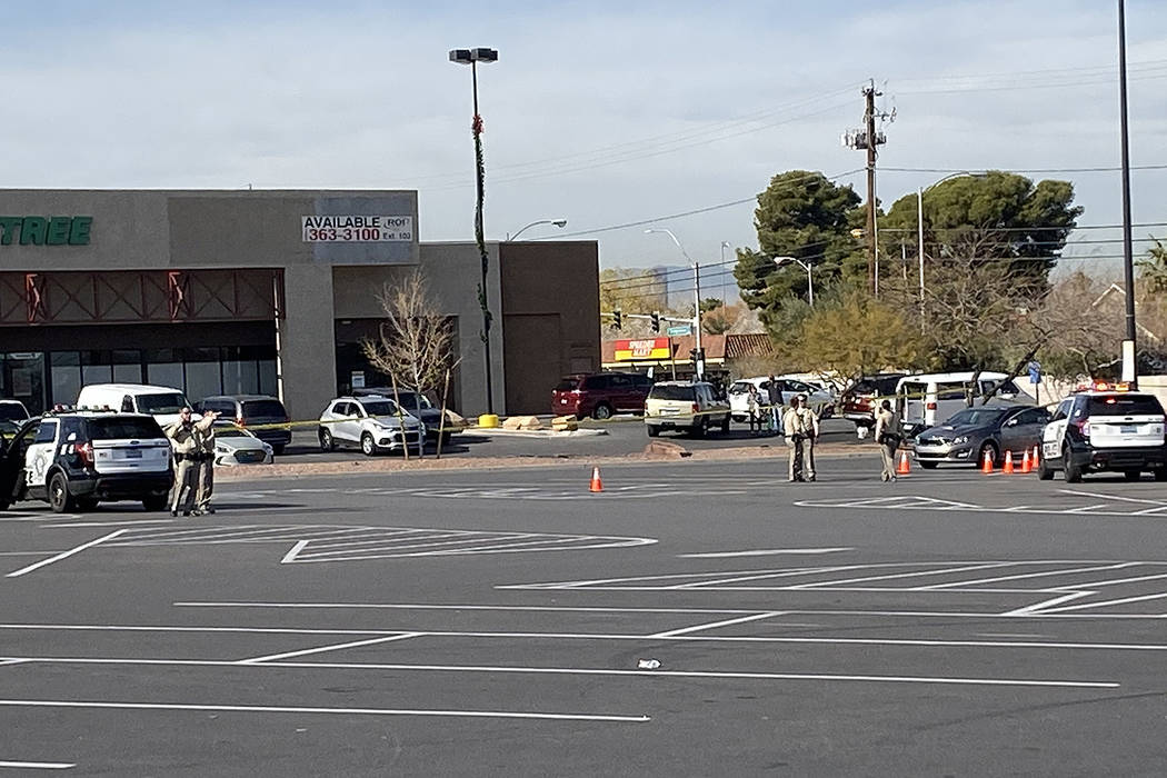 Police investigate a shooting in a Walmart parking lot near East Tropicana Avenue and McLeod Dr ...